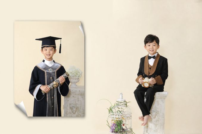 학사모와 졸업가운을 입고 졸업증서를 든 남자아이 컨셉촬영